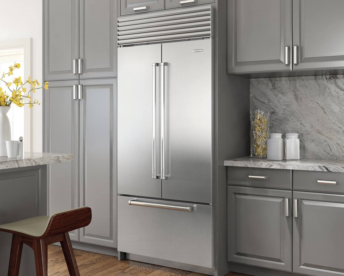 sub zero refrigerator in grey kitchen